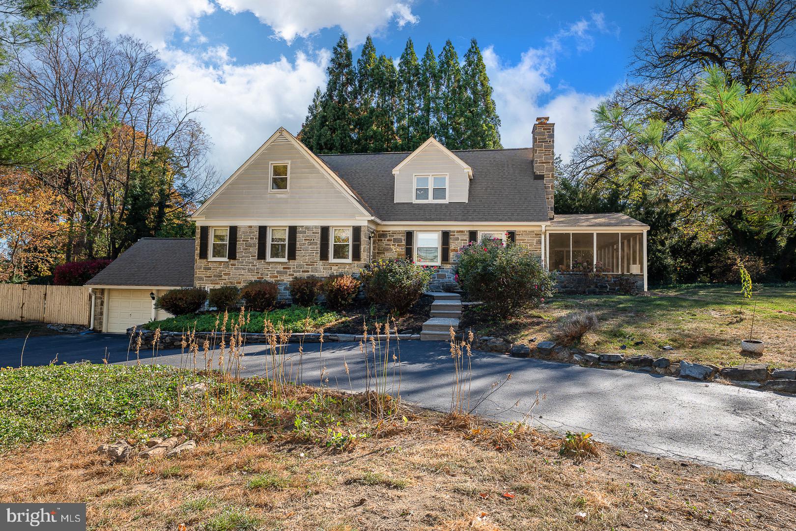 401 North Spring Mill Road Villanova, PA 19085 - Photo 4 of 76 a front view of a house with garden