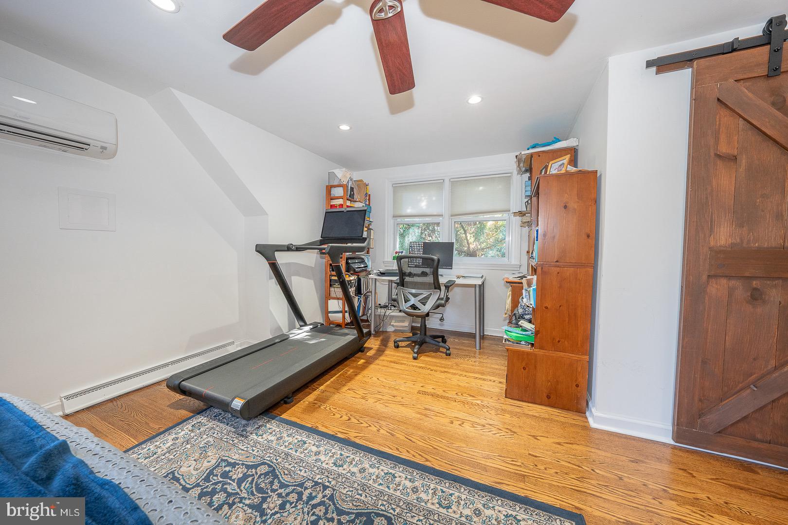 401 North Spring Mill Road Villanova, PA 19085 - Photo 43 of 76 a room with gym equipment and wooden floor