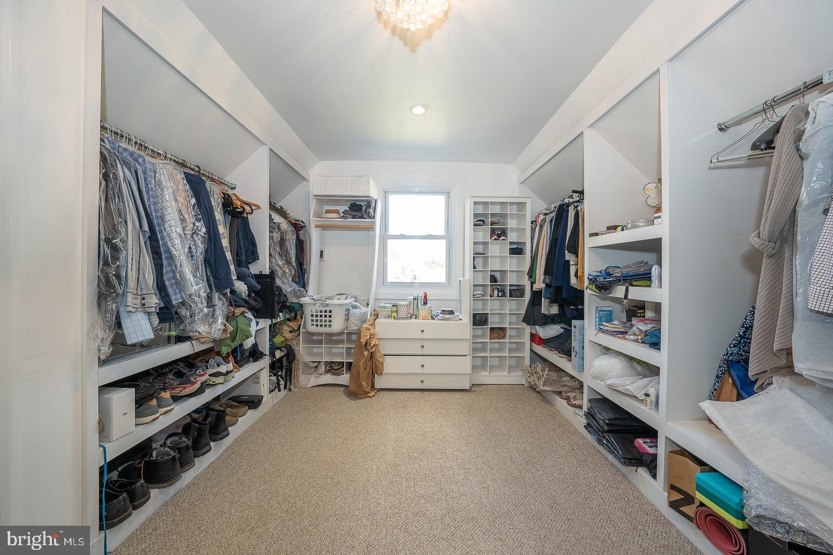 401 North Spring Mill Road Villanova, PA 19085 - Photo 44 of 76 a view of walk in closet with clothes and shoes