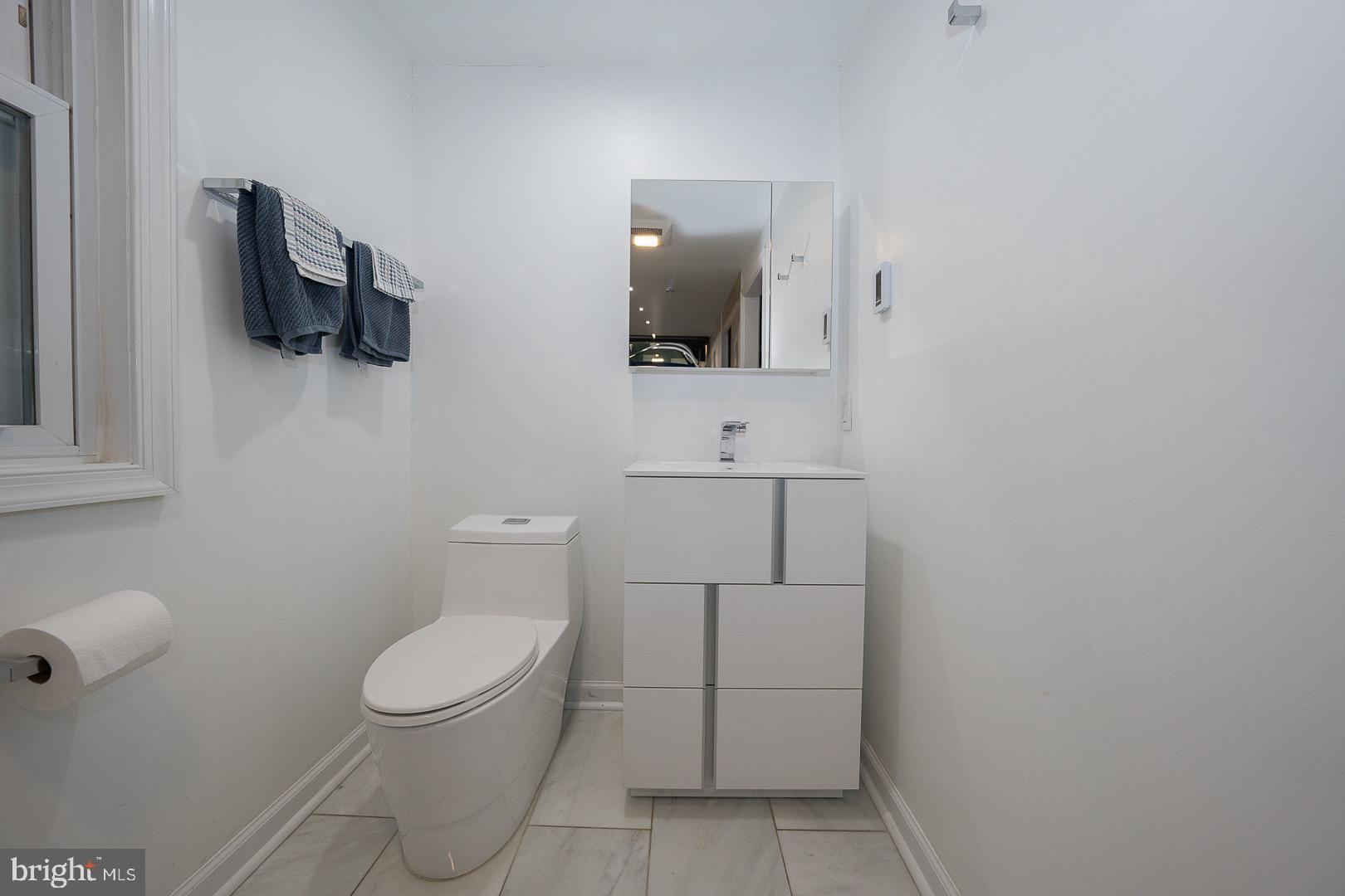 401 North Spring Mill Road Villanova, PA 19085 - Photo 47 of 76 a white toilet sitting next to a bathroom sink