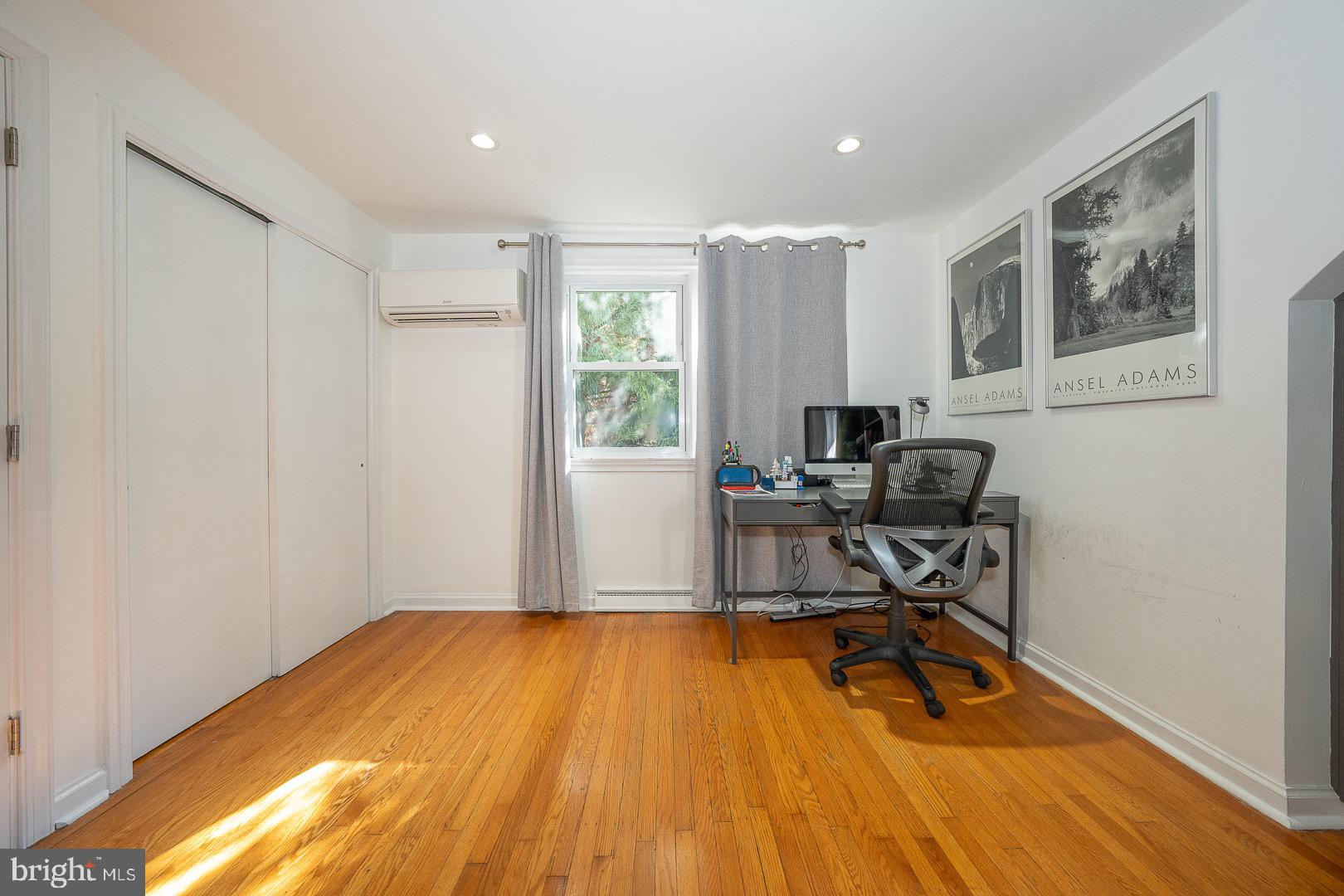 401 North Spring Mill Road Villanova, PA 19085 - Photo 52 of 76 a view of a workspace with wooden floor and a window