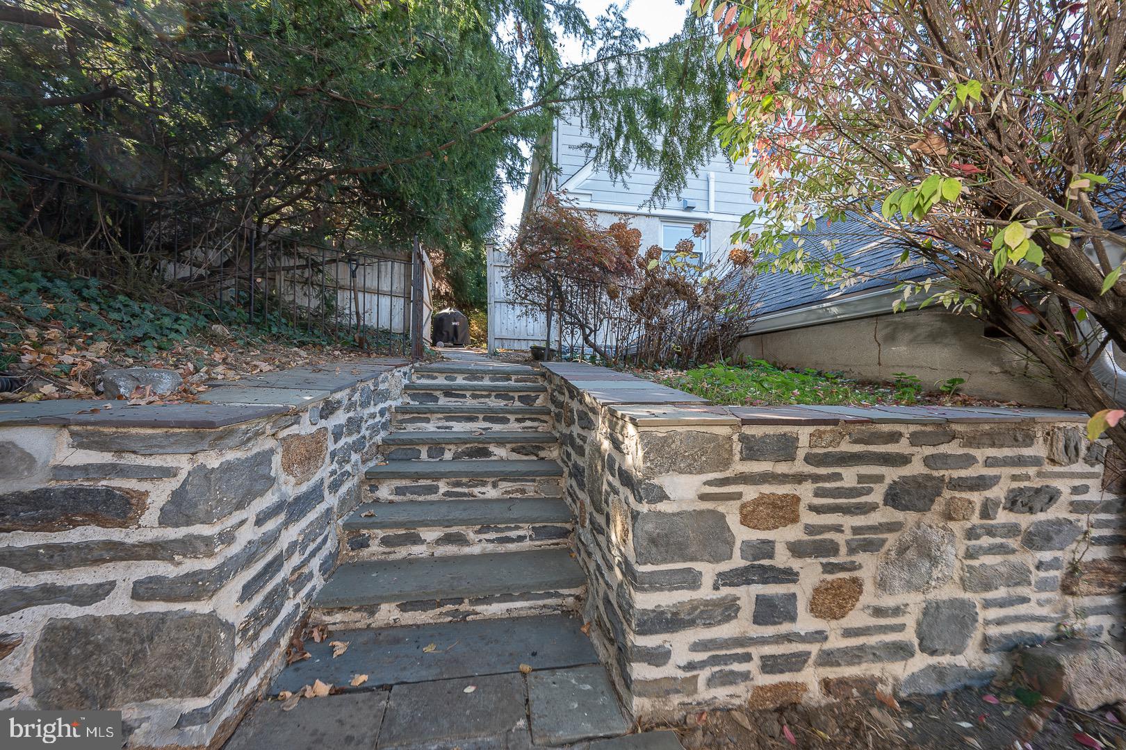 401 North Spring Mill Road Villanova, PA 19085 - Photo 61 of 76 a front view of a house with a yard