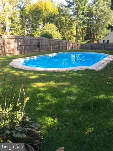 401 North Spring Mill Road Villanova, PA 19085 - Photo 62 of 76 a view of yard with swimming pool and seating