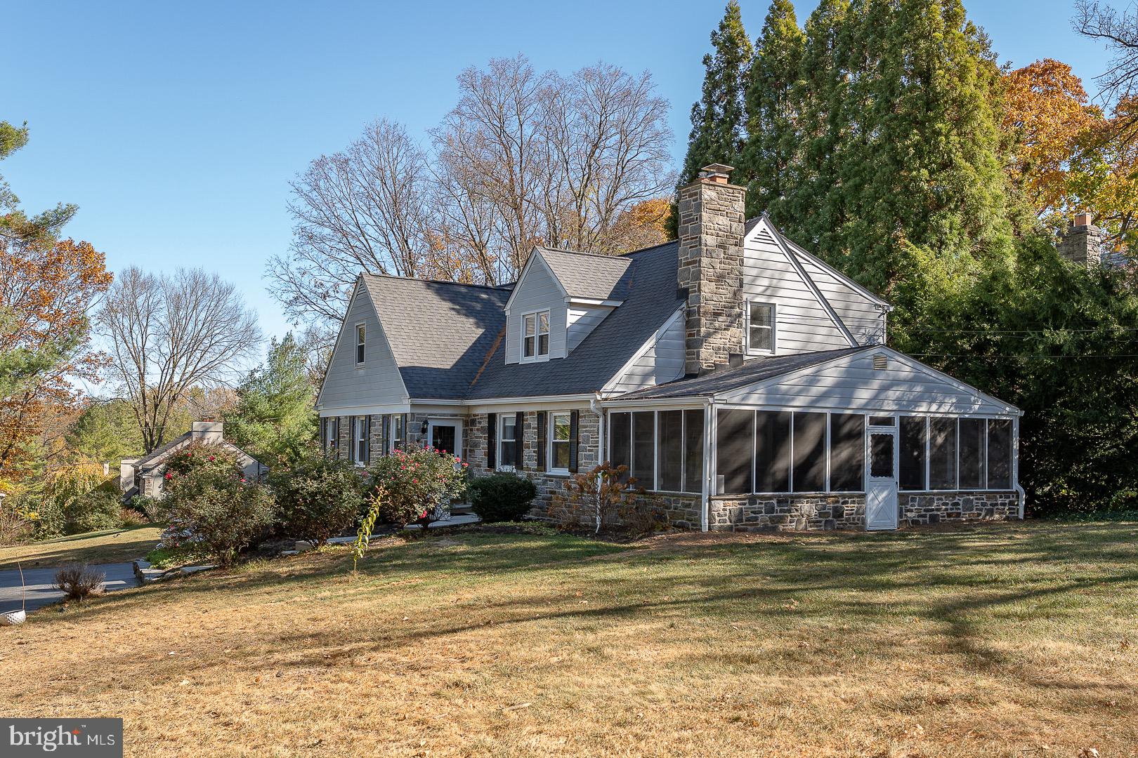 401 North Spring Mill Road Villanova, PA 19085 - Photo 70 of 76 a front view of a house with swimming pool and porch