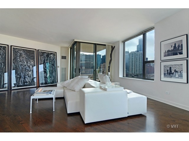 501 North Clinton Street, Unit 1105 Chicago, IL 60654 - Photo 3 of 15 a living room with furniture and large window with outer view