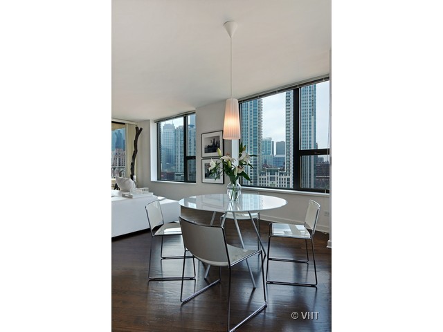 501 North Clinton Street, Unit 1105 Chicago, IL 60654 - Photo 9 of 15 a dining room with furniture and window