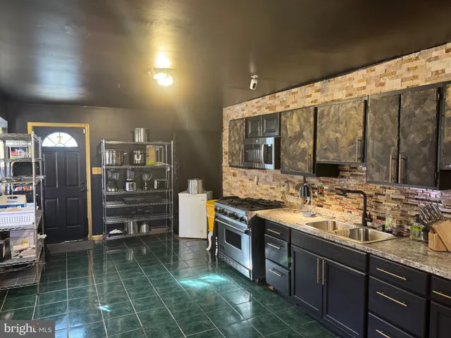 a kitchen with sink cabinets and outdoor view