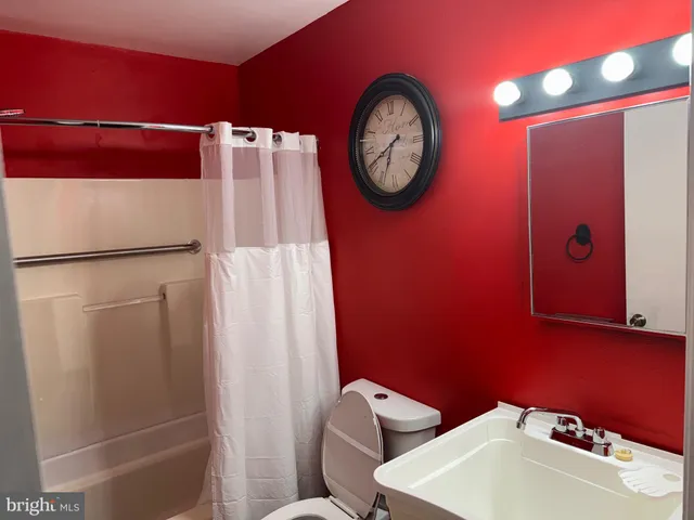 a bathroom with a toilet and a sink