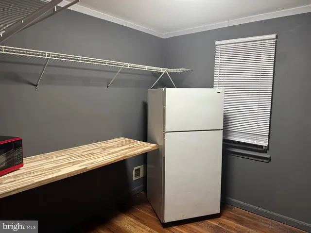 a white refrigerator freezer sitting inside of a kitchen