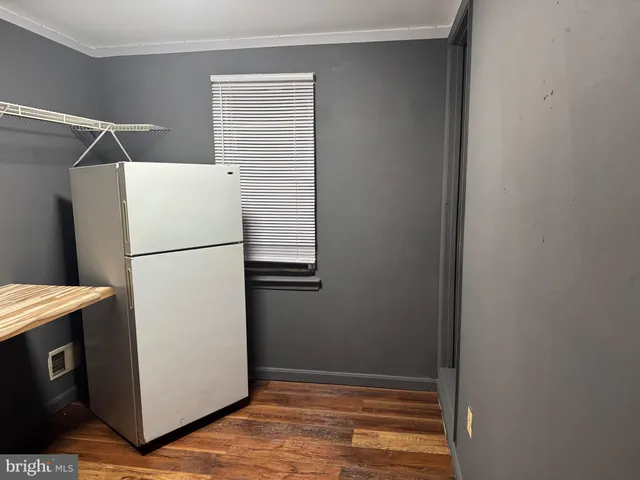 a refrigerator freezer sitting inside of a kitchen