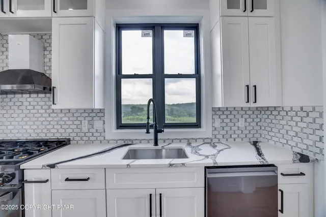 a bathroom with a sink toilet and mirror