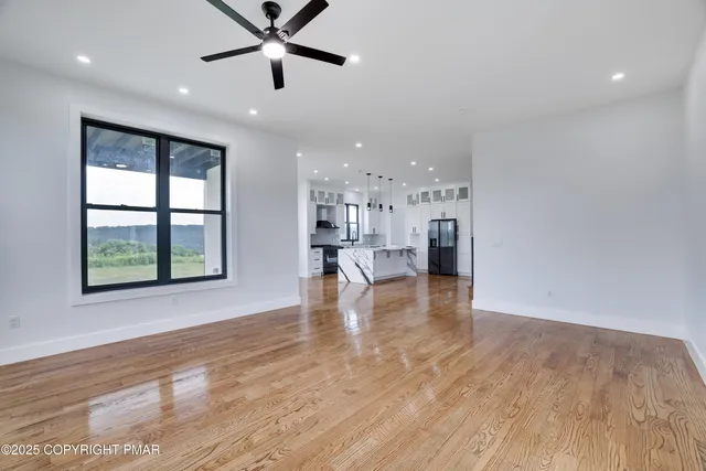 a view of a balcony with floor to ceiling window wooden floor