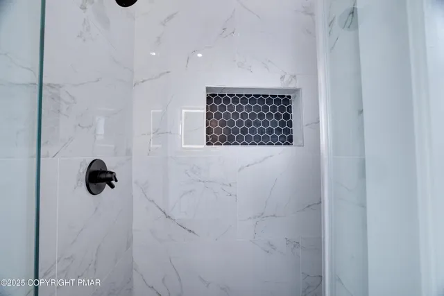a view of a lake with a table and chairs