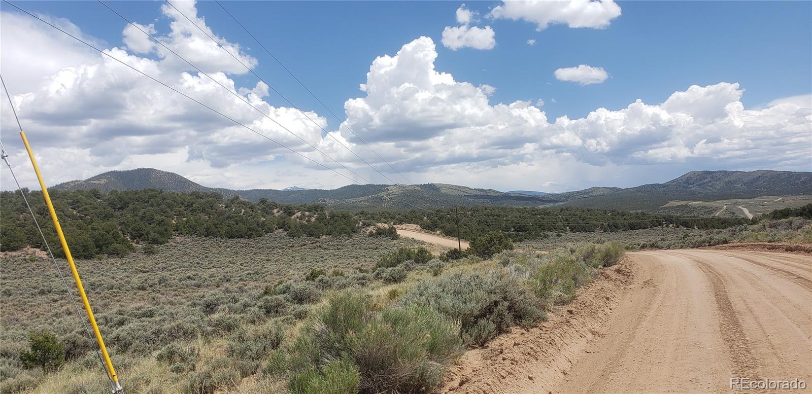 Lot 1505 Juarez & Dunn Road San Luis, CO 81152 - Photo 9 of 18 a view of a city with lush green forest