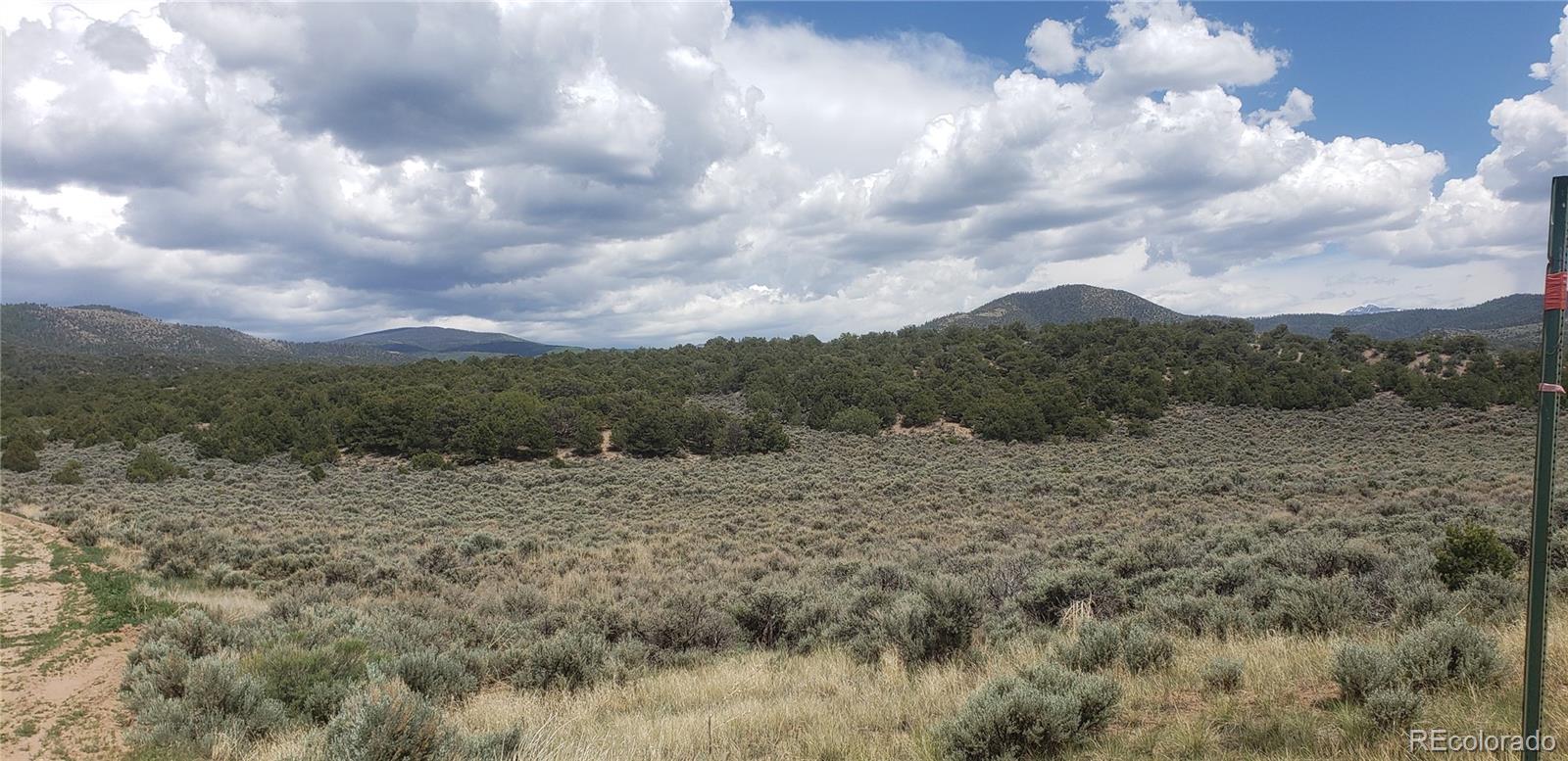 Lot 1505 Juarez & Dunn Road San Luis, CO 81152 - Photo 10 of 18 a view of a dry yard covered with lots of green space