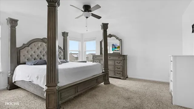 a bed room with a bed and a chandelier