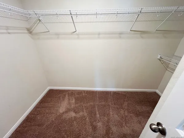 a view of a room with racks on the wall