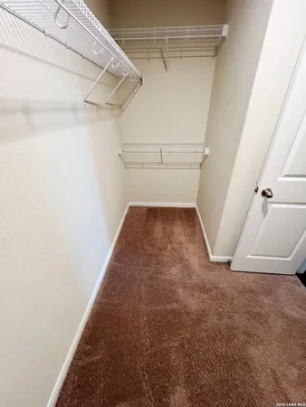 a view of a room with racks on the wall
