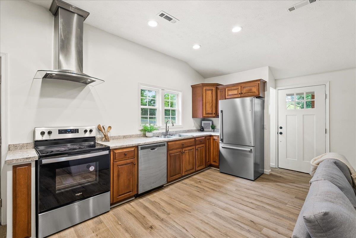 765 Union Church Road Churchville, VA 24421 - Photo 13 of 35 a kitchen with stainless steel appliances granite countertop a stove a refrigerator and a wooden cabinets