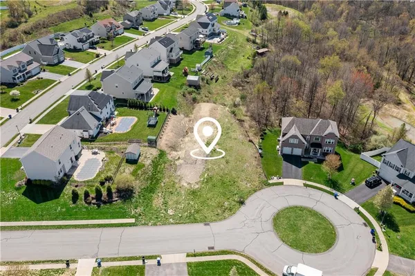 an aerial view of a house with outdoor space