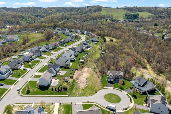 an aerial view of multiple house with yard