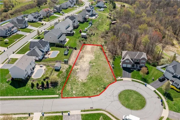 an aerial view of a house with outdoor space