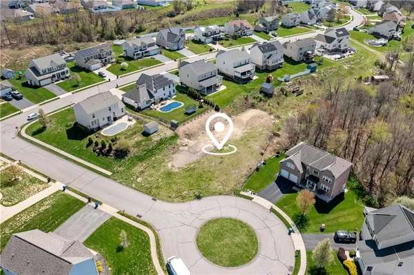an aerial view of a house with a swimming pool yard and outdoor seating