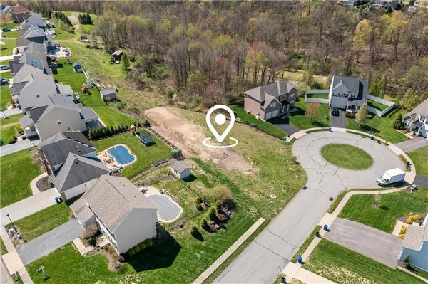 an aerial view of a house with outdoor space