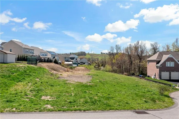 a view of multiple houses with a yard
