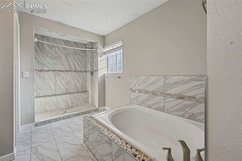 7865 Wilson Road Fountain, CO 80817 - Photo 24 of 46 a bathroom with a bathtub