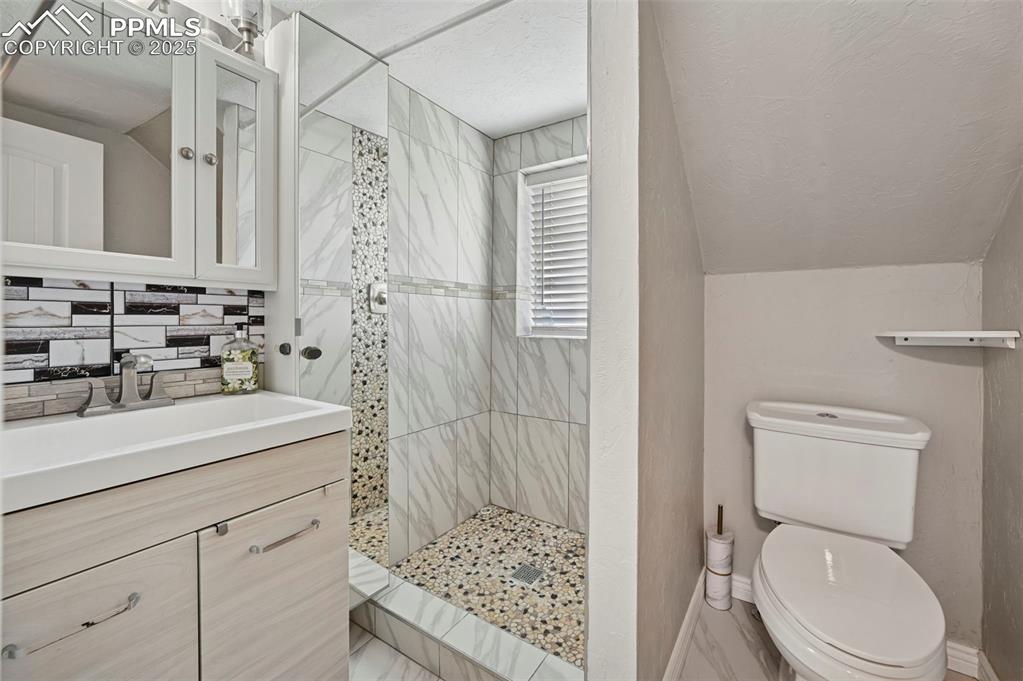7865 Wilson Road Fountain, CO 80817 - Photo 27 of 46 a bathroom with a sink a toilet and shower