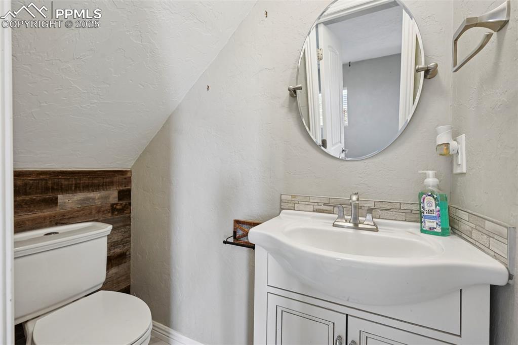 7865 Wilson Road Fountain, CO 80817 - Photo 28 of 46 a bathroom with a sink a toilet and a mirror