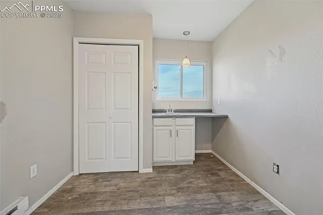a view of storage and utility room with washer and dryer