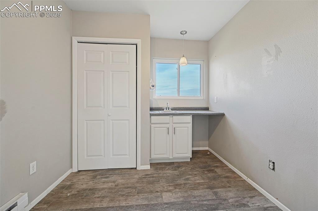 7865 Wilson Road Fountain, CO 80817 - Photo 31 of 46 a view of storage and utility room with washer and dryer