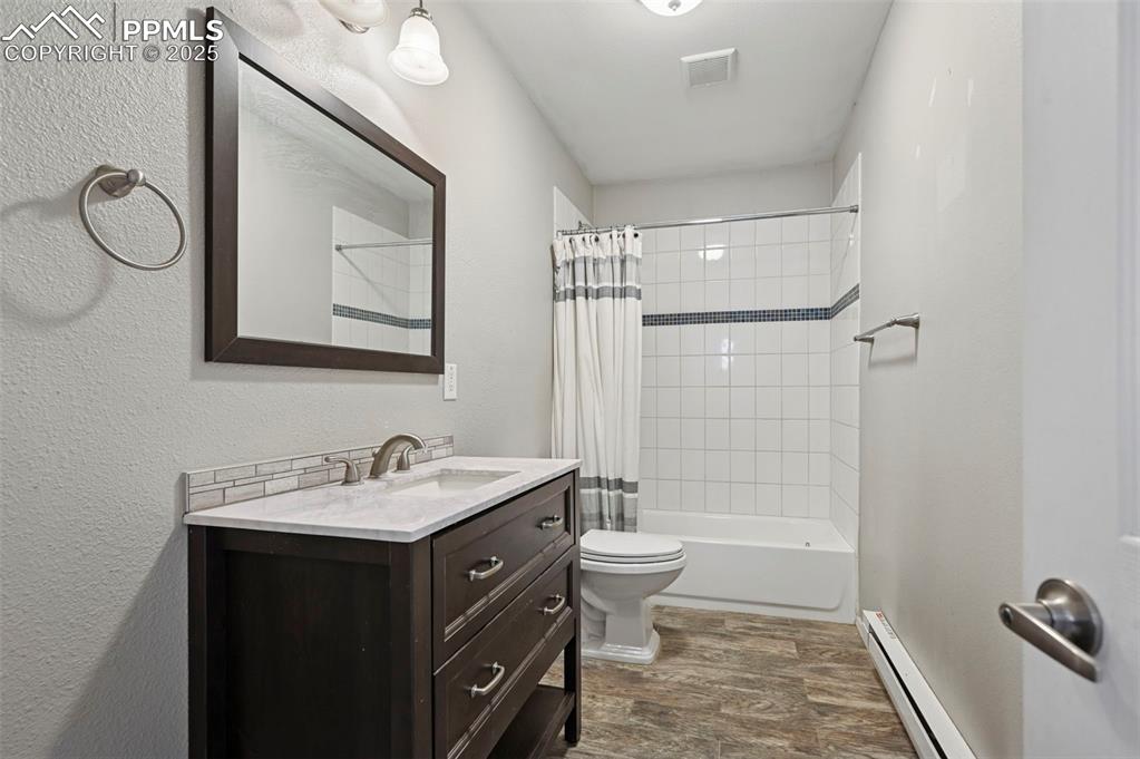 7865 Wilson Road Fountain, CO 80817 - Photo 34 of 46 a bathroom with a tub sink toilet and shower