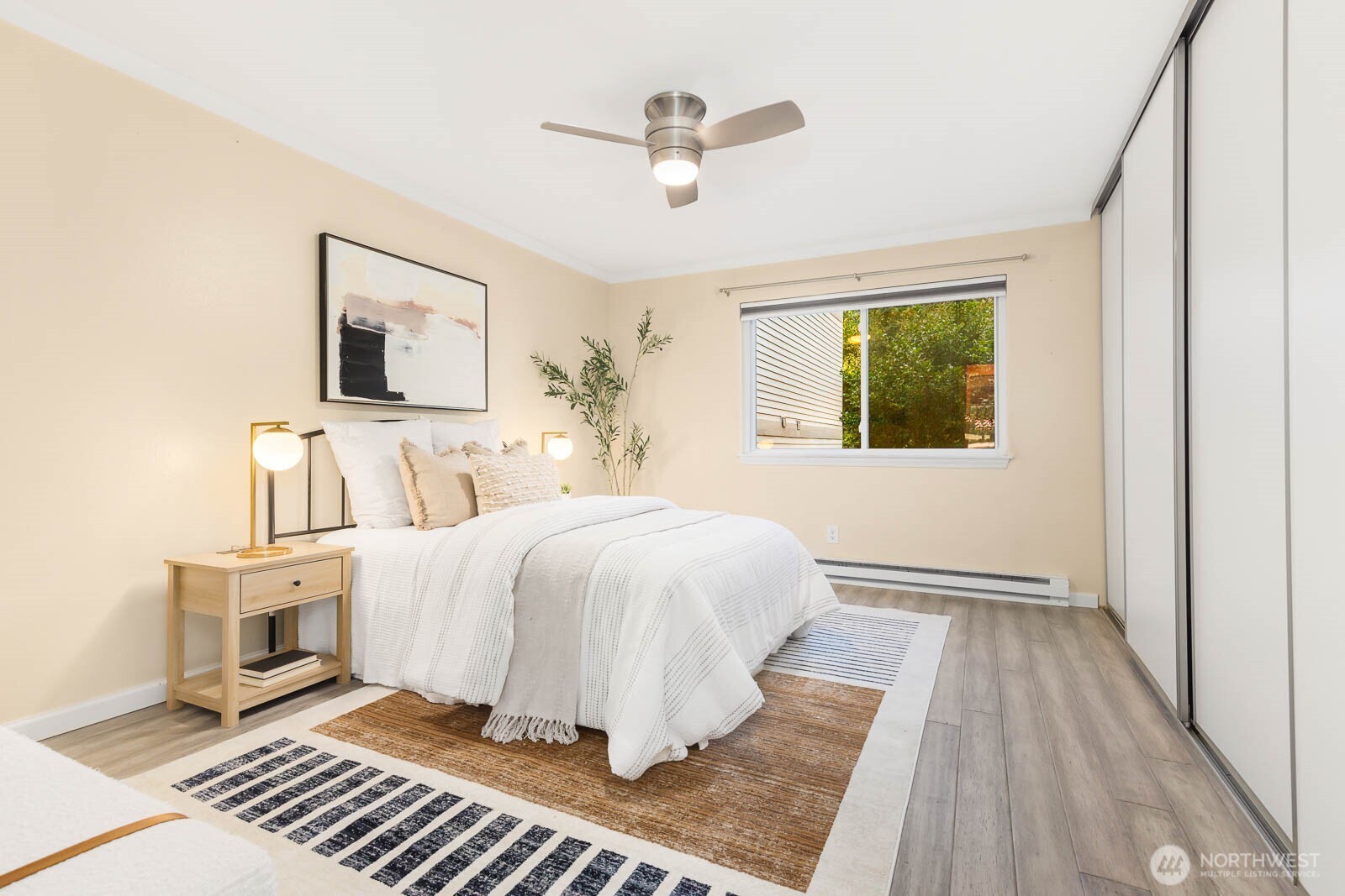 13279 15th Avenue Northeast, Unit B20 Seattle, WA 98125 - Photo 14 of 32 a spacious bedroom with a bed and a window