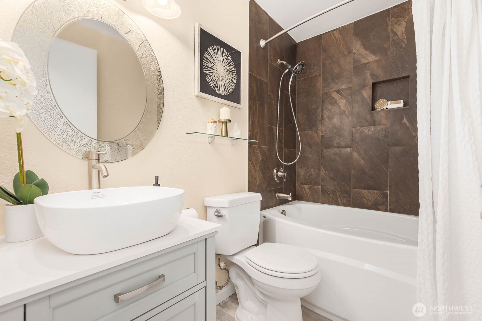 13279 15th Avenue Northeast, Unit B20 Seattle, WA 98125 - Photo 16 of 32 a bathroom with a sink a mirror toilet and bathtub