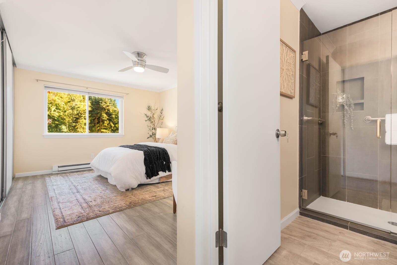 13279 15th Avenue Northeast, Unit B20 Seattle, WA 98125 - Photo 17 of 32 a bedroom with a bed and wooden floor