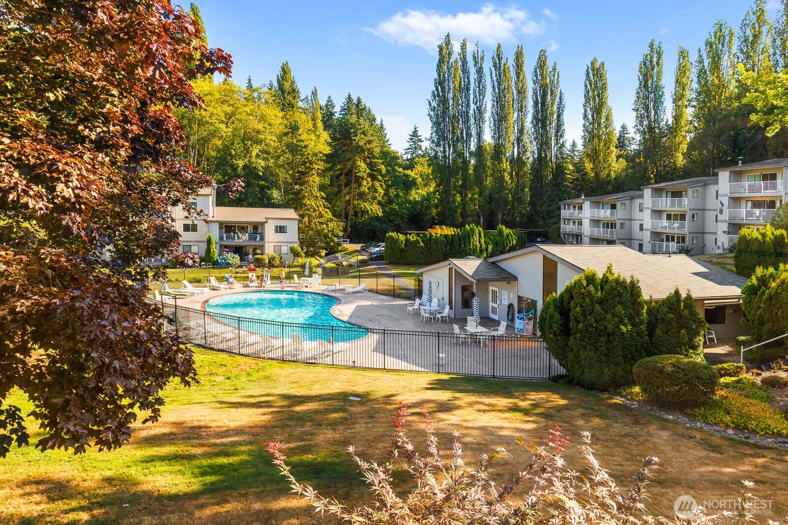 13279 15th Avenue Northeast, Unit B20 Seattle, WA 98125 - Photo 25 of 32 a view of a swimming pool with a patio