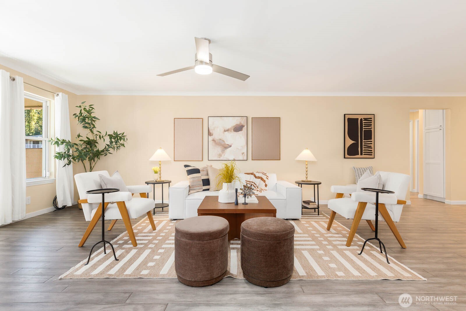 13279 15th Avenue Northeast, Unit B20 Seattle, WA 98125 - Photo 4 of 32 a living room with furniture a rug and a chandelier