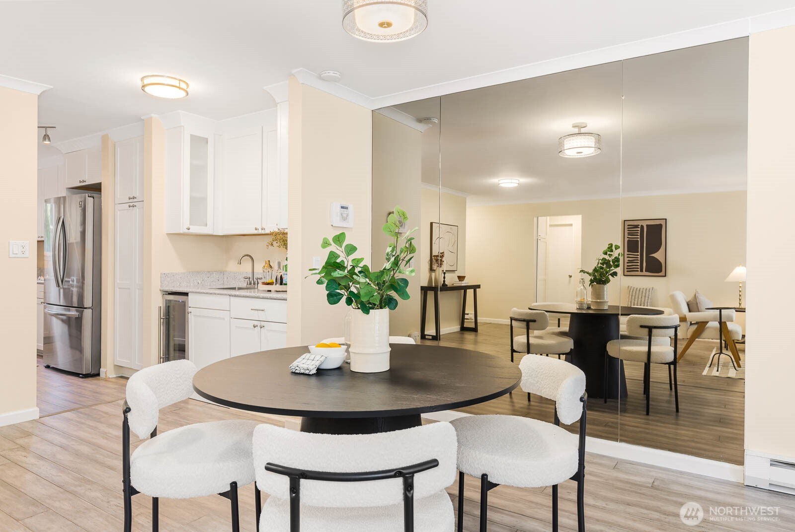 13279 15th Avenue Northeast, Unit B20 Seattle, WA 98125 - Photo 8 of 32 a view of a dining room with furniture and wooden floor