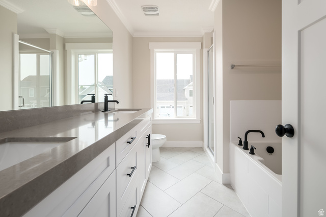 8797 Green Way, Unit 3 Sandy, UT 84094 - Photo 7 of 12 Full bath with a stall shower, double vanity, light tile patterned floors, a bath, and ornamental molding