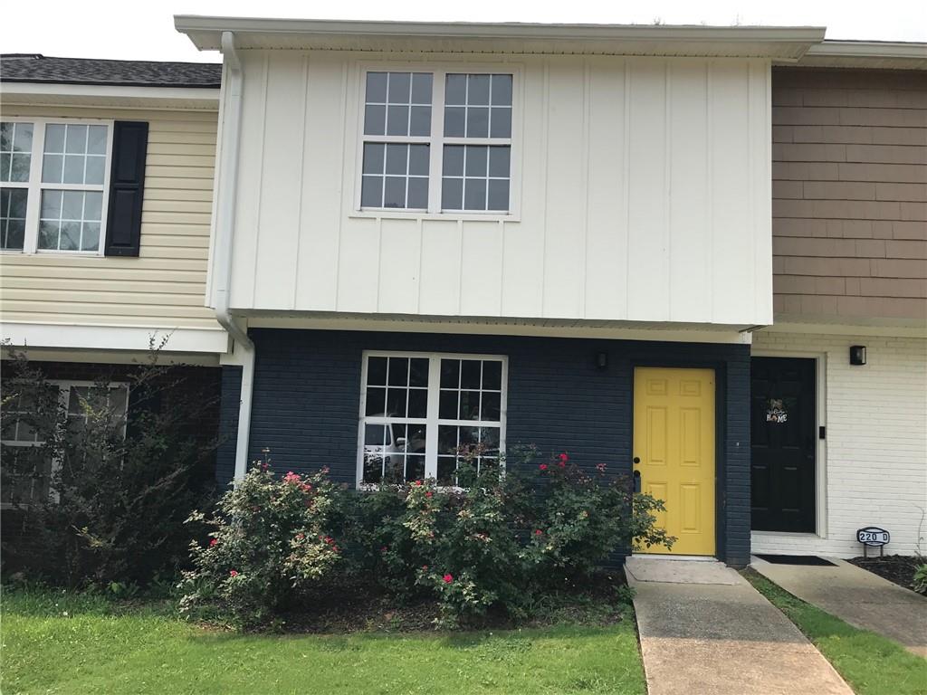 220 Evergreen Trail Southeast, Unit C Cartersville, GA 30121 - Photo 1 of 1 a front view of a house with garden