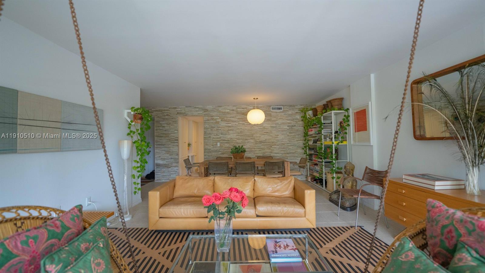 199 Ocean Ln Drive, Unit 313 Key Biscayne, FL 33149 - Photo 2 of 9 a living room with furniture and a potted plant