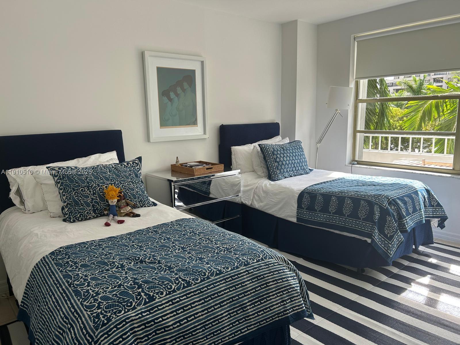 199 Ocean Ln Drive, Unit 313 Key Biscayne, FL 33149 - Photo 4 of 9 a bedroom with two beds and a window