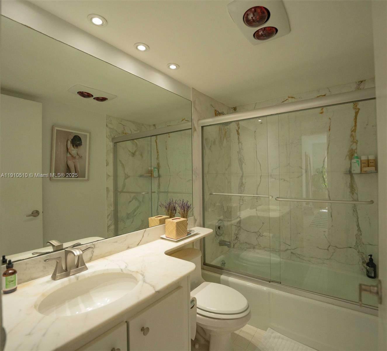 199 Ocean Ln Drive, Unit 313 Key Biscayne, FL 33149 - Photo 7 of 9 a bathroom with a sink toilet and shower