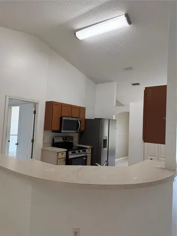 a view of a sink and a microwave