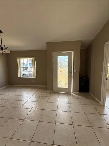 a view of a electric appliances and cabinets in a room