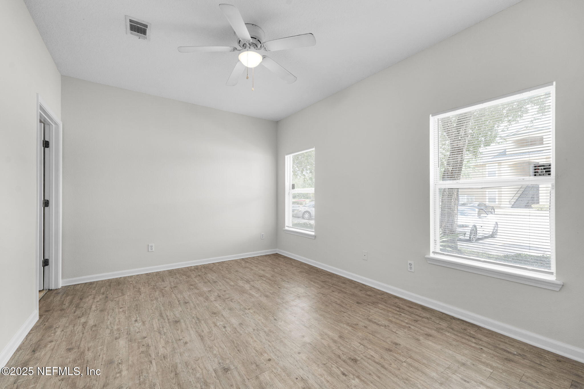 3620 Kirkpatrick Circle, Unit 3 Jacksonville, FL 32210 - Photo 15 of 22 a view of empty room with wooden floor and fan