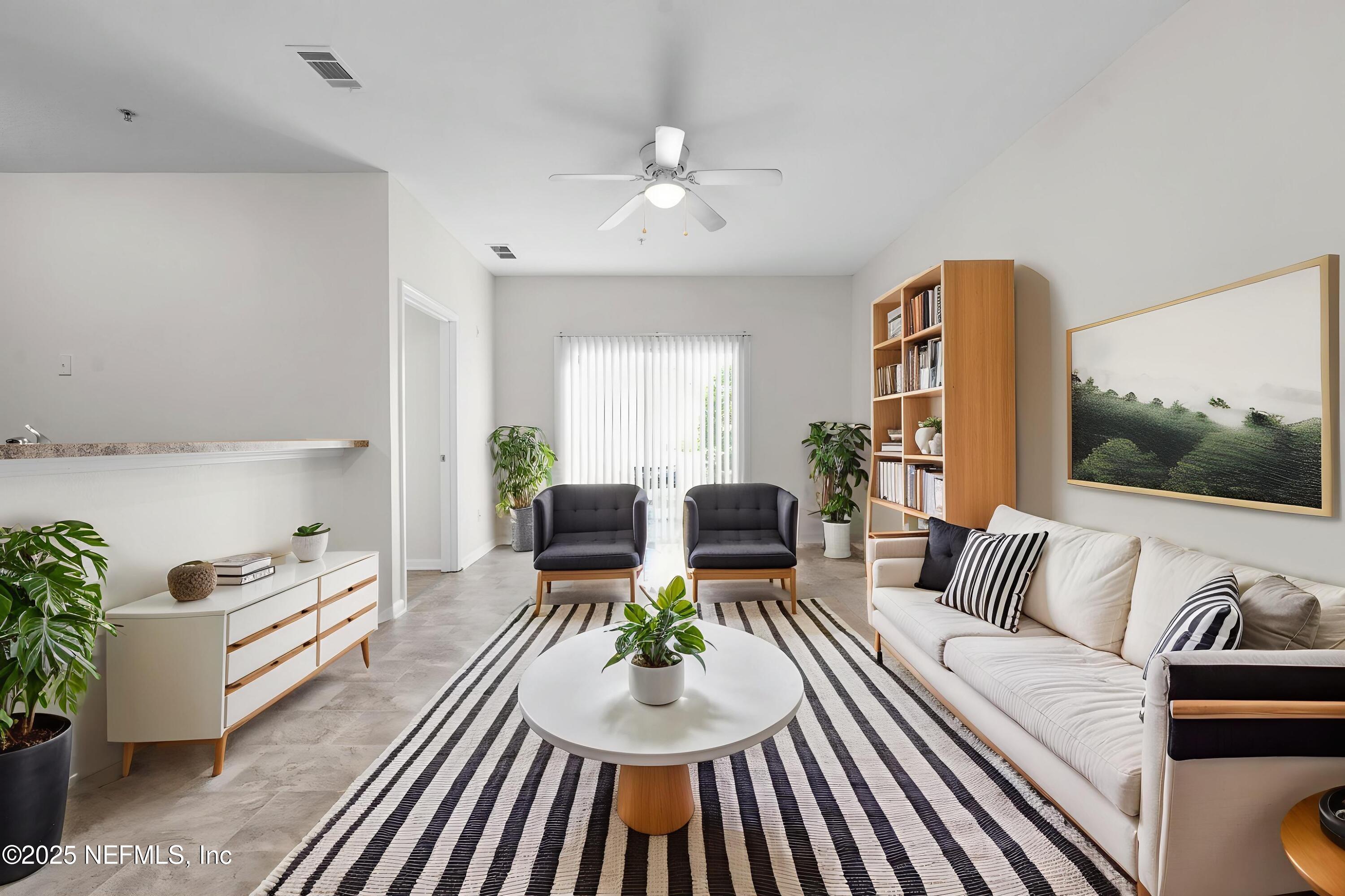3620 Kirkpatrick Circle, Unit 3 Jacksonville, FL 32210 - Photo 5 of 22 a living room with furniture and a wooden floor